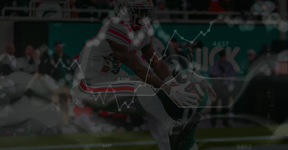 Football player making a contested catch with overlaid data charts and numbers, symbolizing real-time sports betting insights and loyalty-linked moment triggers.
